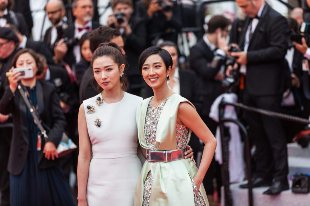 Wan Qian and Gwei Lun Mei depart the screening of “The Wild Goose Lake (Nan Fang Che Zhan De Ju Hui/ Le Lac Aux Oies Sauvages)” during the 72 annual Cannes Film Festival