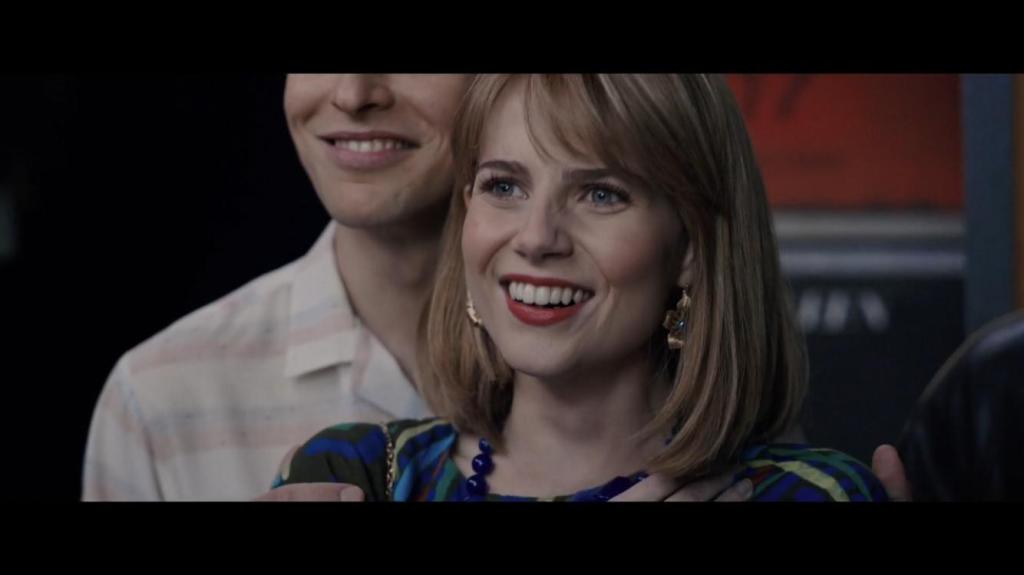 Lucy Boynton as Mary Austen at Live Aid in Bohemian Rhapsody, 2018 